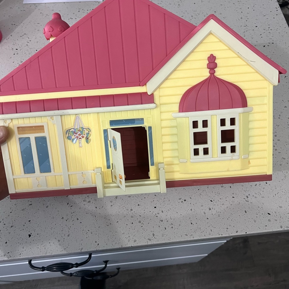 Charming Pink and Yellow Dollhouse